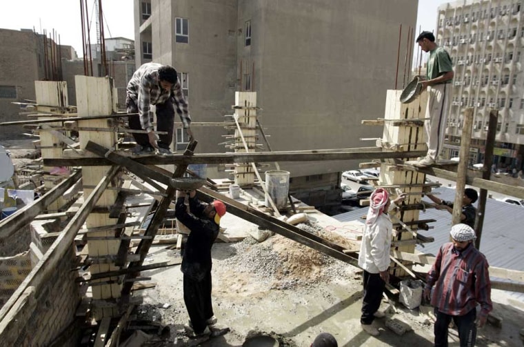 Iraqi men work on a construction site in central Baghdad. 