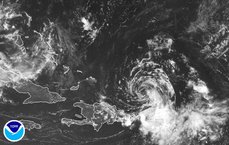 A satellite image provided by the National Oceanic and Atmospheric Administration shows Tropical Storm Chris at 1:15 p.m. EST on Thursday. 