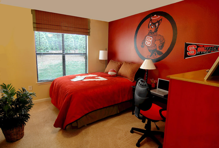A bedroom in the University Village at Raleigh condominium complex near North Carolina State University is seen in this photo from real estate developer The Priess Company. Residents of the 3 bedroom, 3 bathroom units also have access to a clubhouse with a game room and an outdoor pool.