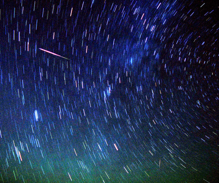 Meteors streak past stars in the night sky near Amman