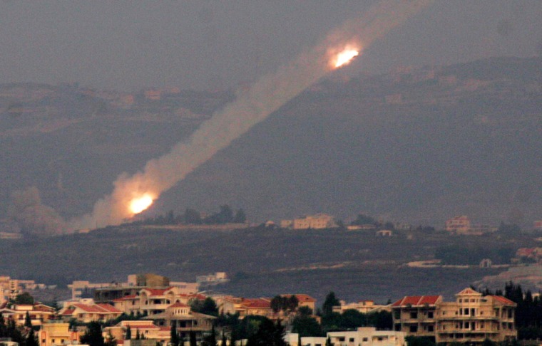 Rockets fired by Hezbollah guerrillas streak toward Israel on Sunday.