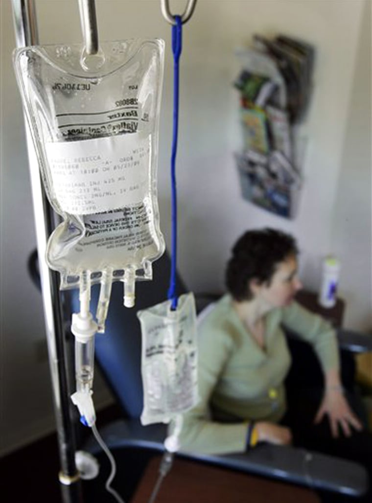 Rebecca Dague receives her weekly Erbitux treatment for colon cancer at University Hospitals Ireland Cancer Center in Westlake, Ohio The expensive biotech drug and other care have drained a third of her $3 million insurance cap. 