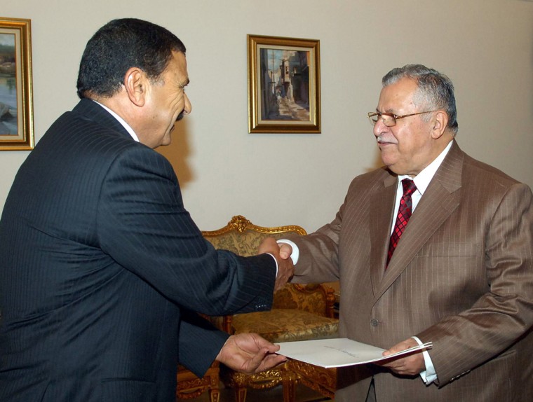 Jordanian envoy Ahmed al-Lozi, left, presents his credentials to Iraqi President Jalal Talabani in Baghdad on Friday. Al-Lozi is the first fully accredited Arab ambassador to Iraq since the fall of Saddam Hussein.