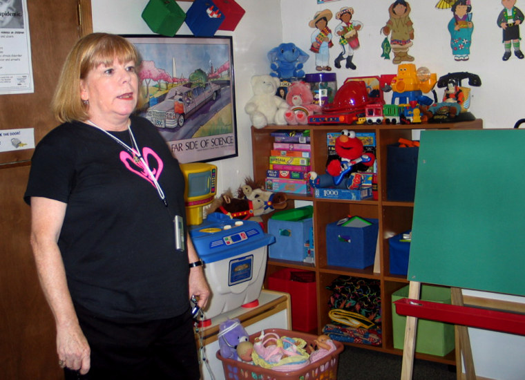 The Metropolitan Center for Women and Children's Executive Director Dale Standifer stands in the main children's playroom.  The shelter provides children with a tutor, homework assistance, and medical attention.