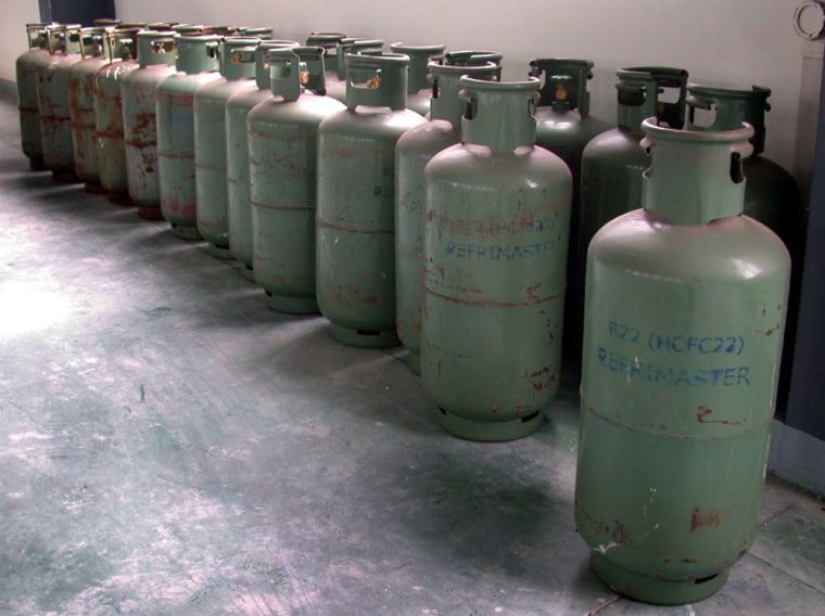 ** ADVANCE FOR MONDAY AUGUST 21, 2006, AND THEREAFTER ** This Nov. 2005 photograph provided by the Environment Investigation Agency shows more than 2 dozen cylinders of HCFC-22 refrigerant chemicals, also known as R22, at a facility operated by the Ningbo Koman Refrigeration Industry Co., Ltd., in China's Zhejiang province.  A U.N. report says the atmosphere could be spared the equivalent of 1 billion tons of carbon dioxide emissions if nations, instead of HCFCs and HFCs, used ammonia, hydrocarbons, injected carbon dioxide or other ozone-friendly chemicals in foams and refrigerants. Under the Montreal Protocol treaty, industrial countries have until 2030 and developing countries until 2040 to quit using HCFCs and HFCs.  (AP Photo/Environment Investigation Agency, Ezra Clark)