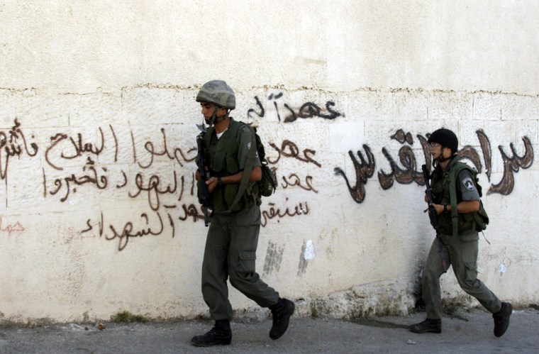 Israeli soldiers patrol during an army operation in the village of Sila near the West Bank town of Jenin, on Sunday, Aug. 6.