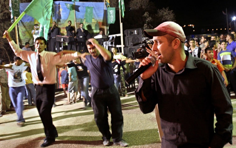 Northern Band singer Alaa Abu al-Haija, 28, performs the "Hawk of Lebanon" song, which praises Hezbollah chief Hassan Nasrallah at a wedding in the West Bank village of Al-Sawiya on Aug. 23.