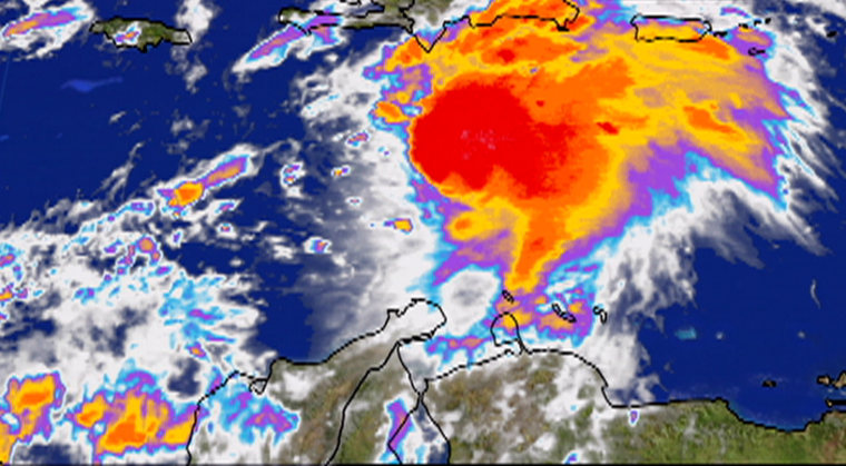 Tropical Storm Ernesto, seen over the Caribbean, is projected to become a hurricane by Tuesday.