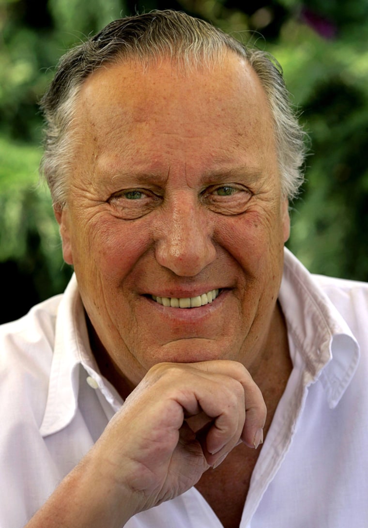 British novelist Frederick Forsyth smiles during an interview with Reuters at his home near Hertford