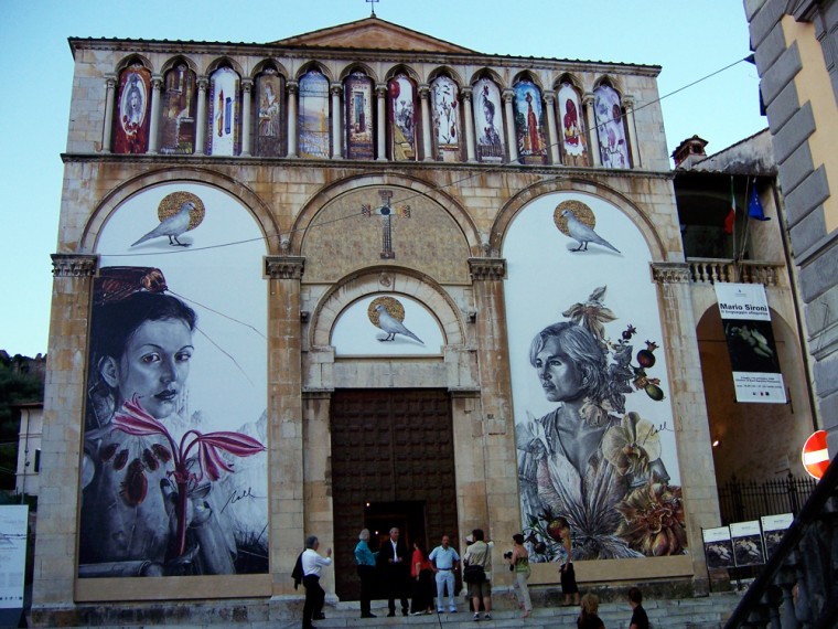 The facade of the Church of St. Augustine in Pietrasanta has been redecorated with massive renditions of Nall's work.