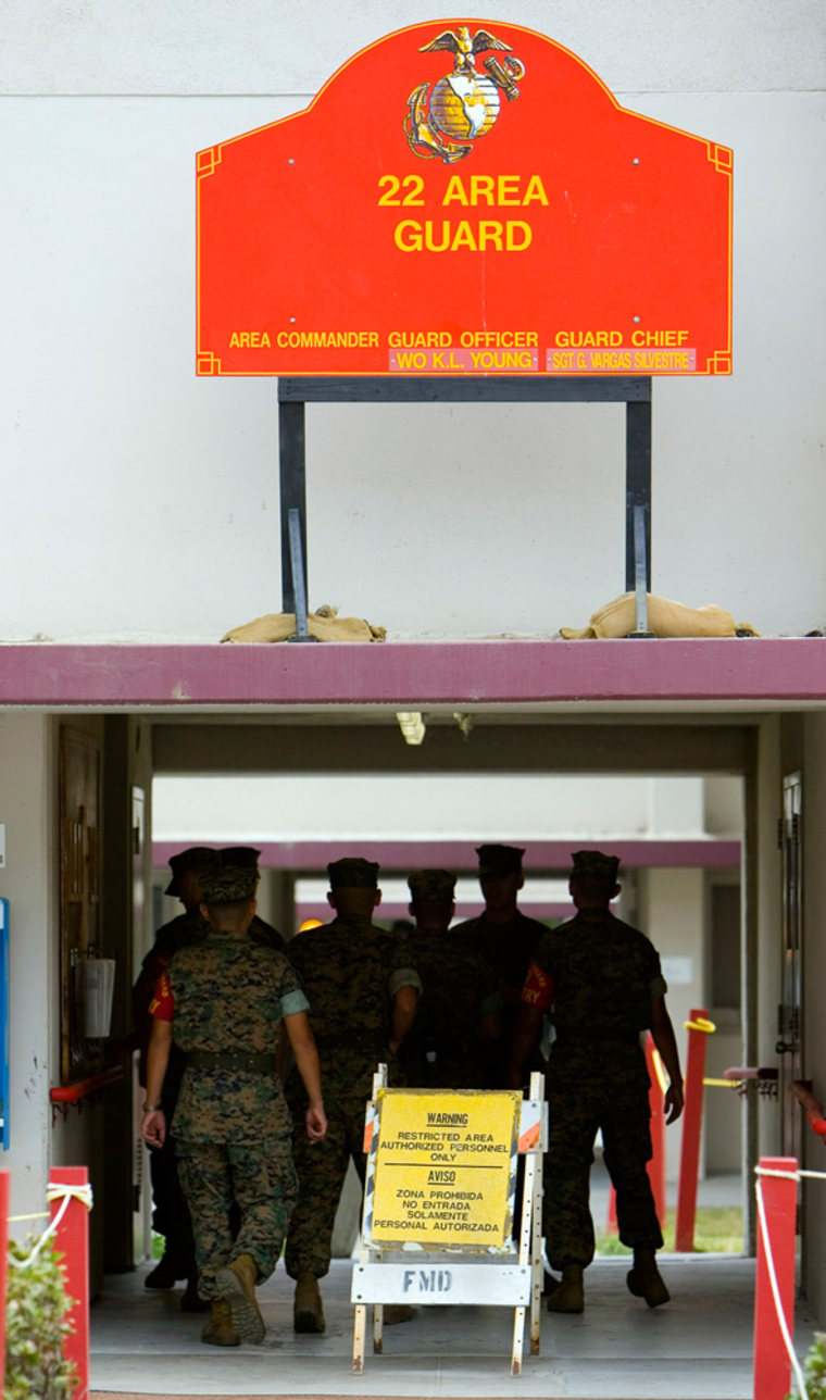 U.S. Marines walk through a secure area of the U.S. Marine Corps Camp Pendleton in Oceanside