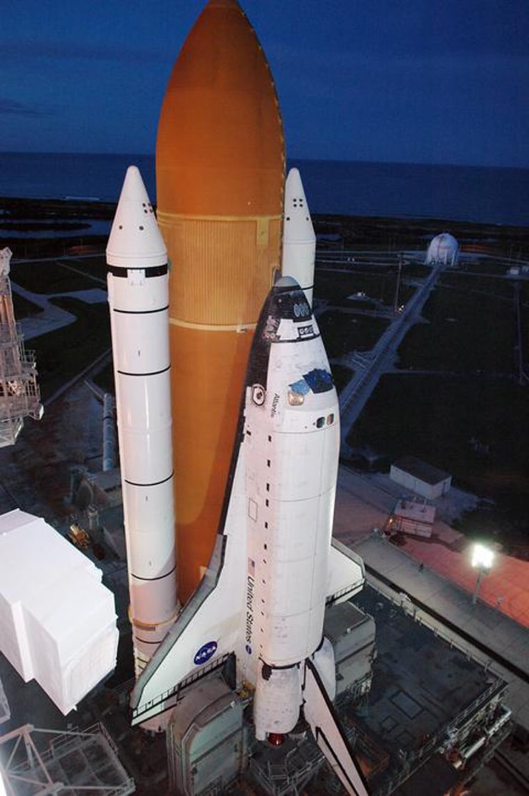 The space shuttle Atlantis sits on its launch pad at NASA's Kennedy Space Center in Florida. Mission managers said the shuttle weathered Tropical Depression Ernesto and would be in good shape for launch attempts next week.