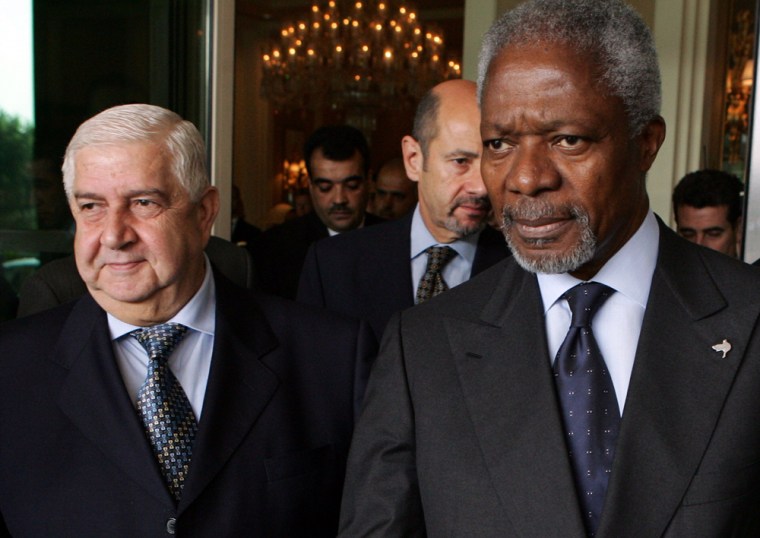 UN Secretary-General Annan walks with Syrian Foreign Minister Al-Moualem in Damascus