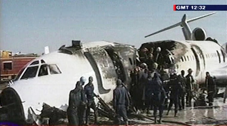 A video grab shows firefighters working in the remains of an Iranian passenger plane in Mashhad