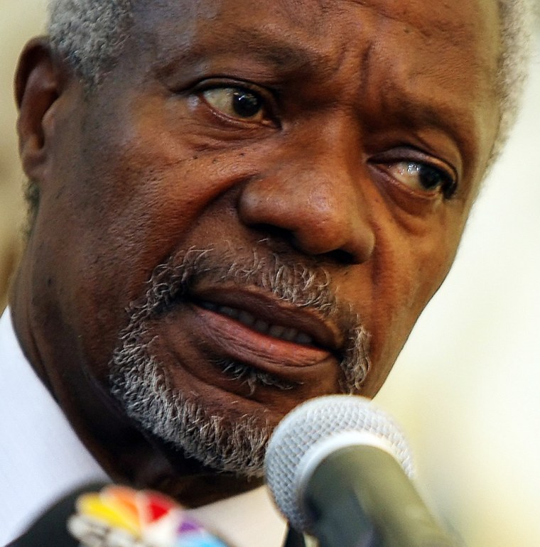 UN Secretary General Kofi Annan holds a