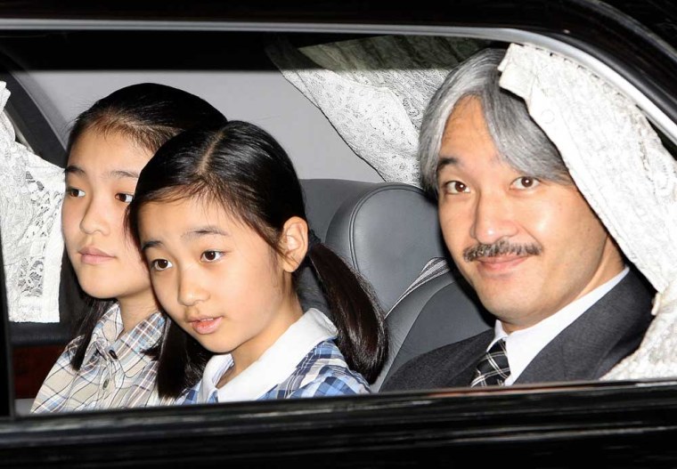 Japanese Prince Akishino and his daughters, Princess Mako, left, and Princess Kako arrive at Aiiku hospital in Tokyo, on Wednesday, to see Princess Kiko and her newly-born baby boy.
