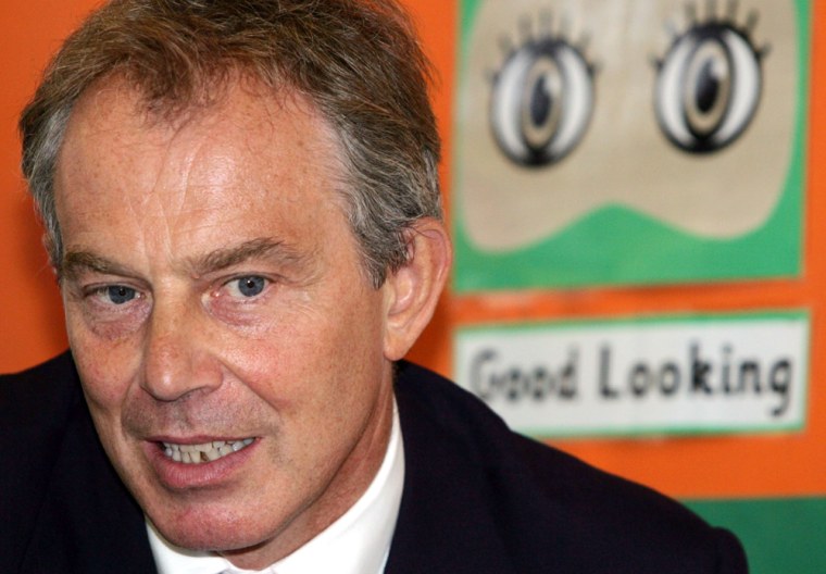 British Prime Minister Blair listens during class at Seven Mills primary school in east London