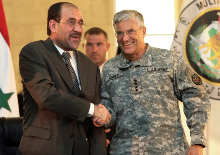Iraqi Prime Minister Nuri al-Maliki (L)