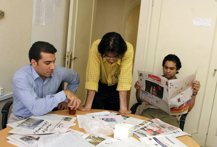 Iranian journalists of the prominent reformist daily Shargh read the last editions of their newspaper on Monday. The paper was closed down by the Iranian Press Supervisory Board on Monday because of what journalists said was a cartoon dealing with the country's controversial nuclear program. 
