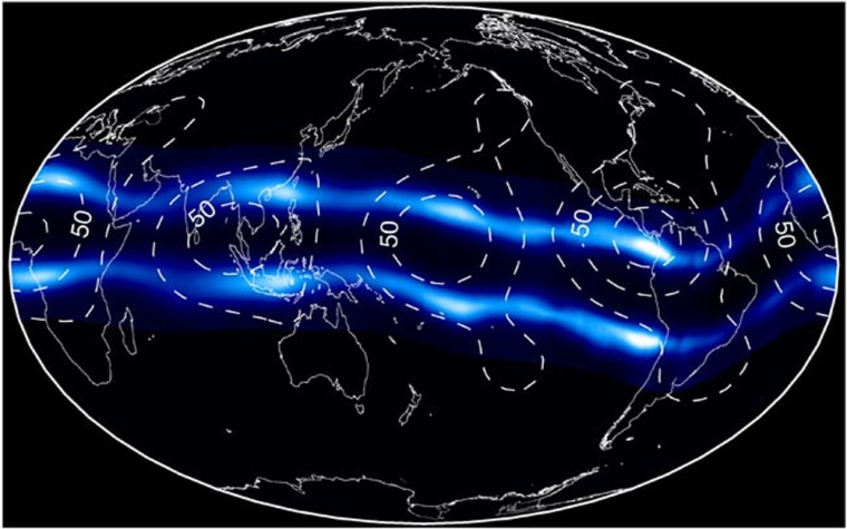 A false-color composite image shows ultraviolet light from two plasma bands in the ionosphere encircling Earth over the equator. Bright, blue-white areas are where the plasma is densest. Solid white lines outline the continents; Africa is on the left, and North and South America are on the right.