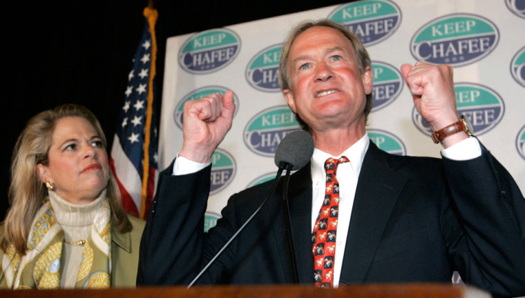 US Senator Lincoln Chafee speaks to supporters as his wife Stephanie listens at his election night rally in Providence