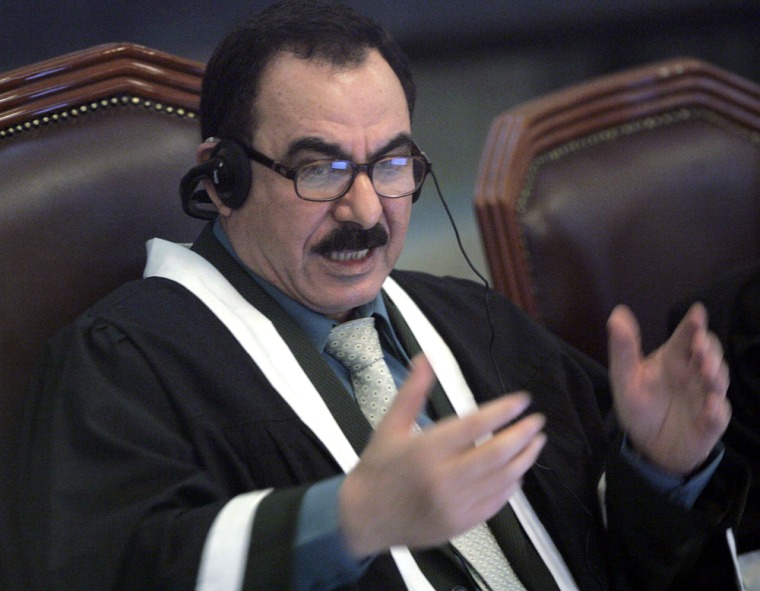 Chief judge al-Amiri addresses court during the trial of former Iraqi President Saddam Hussein at the fortified Green Zone in Baghdad