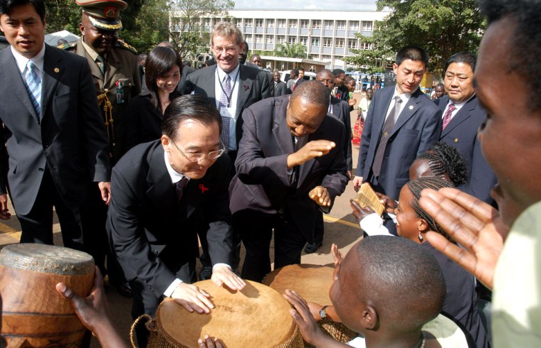 Chinese Premier Wen Jiabao plays traditional drums at the Mulago Medical School for HIV/AIDS in Kampala during a trip in June. The premier's visit to Uganda was part of a seven-nation African tour that included stops in Egypt, Ghana, Republic of Congo and Angola, South Africa and Tanzania.  