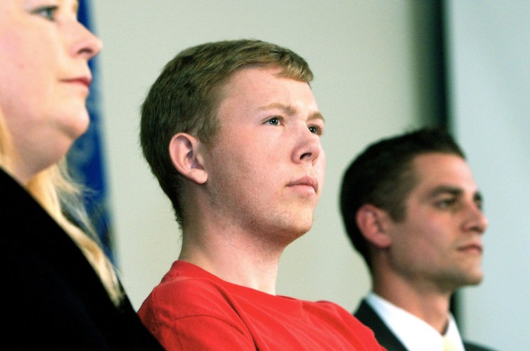 Green Bay East High School senior Matt Atkinson, center, sits during a news conference Wednesday, Sept. 20, 2006, in Green Bay, Wis., with his mother Nancy Dury, left, and Assistant Principal Matt Mineau. Atkinson said he was only doing the right thing when he told authorities his friends were planning a Columbine-like attack on the school last week. Atkinson told Mineau about the plan. (AP Photo/Press-Gazette, B.A. Rupert)