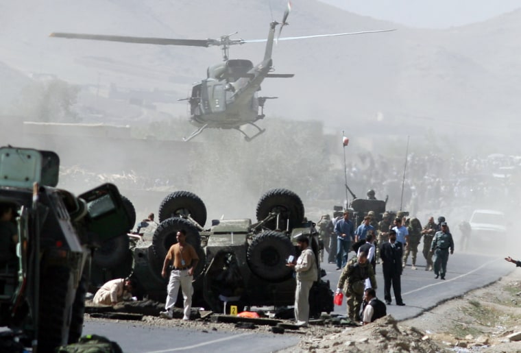 A helicopter carries the body of an Italian soldier killed after a bomb attack against a NATO patrol south of Kabul, Afghanistan, on Tuesday.