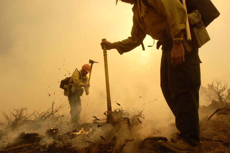 Firefighters work to contain the Day Fire in the Los Padres National Forest in Ventura County, California