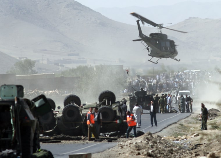 A helicopter carries the body of an Italian soldier killed after a bomb attack against a NATO patrol south of Kabul, Afghanistan, on Sept. 26.
