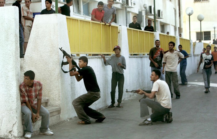 Palestinian gunmen exchange fire with Hamas security forces in Gaza