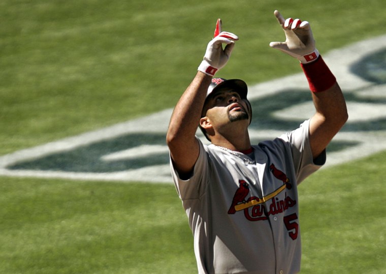 St. Louis Cardinals' Pujols celebrates home run against San Diego Padres during Game 1 of their National League Division Series playoff baseball game in San Diego