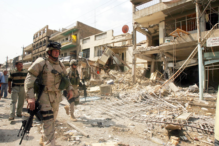 U.S. troops arrive at the site of a bomb blast in Baghdad's Camp Sara, a mainly Christian neighborhood, on Wednesday.