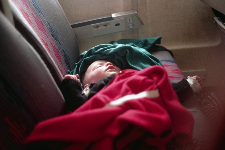 Infant Sleeping on Airplane Seat