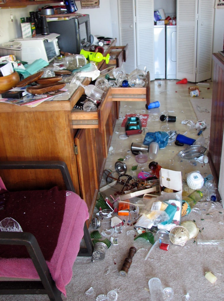 The contents of kitchen cabinets and a refrigerator are spilled across a floor in a Kailua-Kona, Hawaii kitchen after the earthquake that shook Hawaii Sunday Oct. 15, 2006. Similar damage was reported in many homes on the Big Island of Hawaii. The state Civil Defense had unconfirmed reports of injuries, but communication problems prevented more definite reports. Gov. Linda Lingle issued a disaster declaration for the entire state, saying there had been damage to buildings and roads. There were no reports of fatalities. (AP Photo/Karin Stanton)