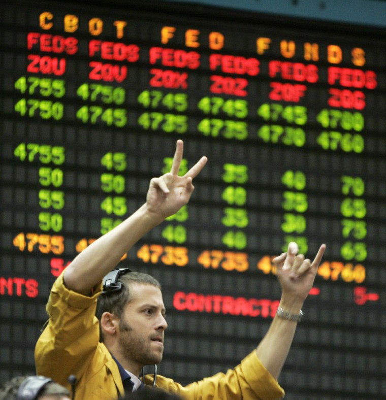 Clerk relays a trade in the Euro Dollar pit at the Chicago Mercantile Exchange