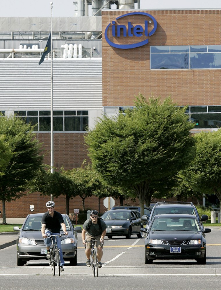 Bicyclists and drivers share the road at Intel's campus in Hillsboro, Ore. The chip maker topped the annual government list of best employers for commute options.