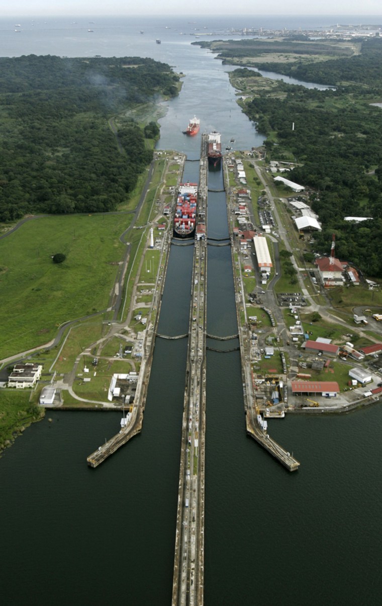 Cargo ships pass through Gatun Locks in Colon, Panama, on Friday.