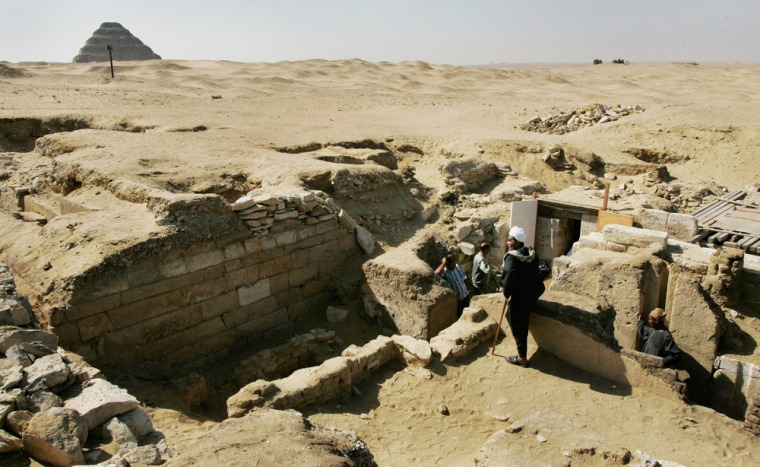 The site of 4,200-year-old tombs honoring a chief dentist and two other dentists who served the nobility of the 5th dynasty, at the Saqarra pyramid complex south of Cairo, Egypt Sunday, Oct. 22, 2006. Enterprising but unlucky thieves, who likely didn't notice a curse inscription just inside the prominent doorway warning that those who enter would be eaten by crocodiles and snakes, led the Egyptian archaeological team to discover the three tombs, which were unveiled Sunday. (AP Photo/Ben Curtis)