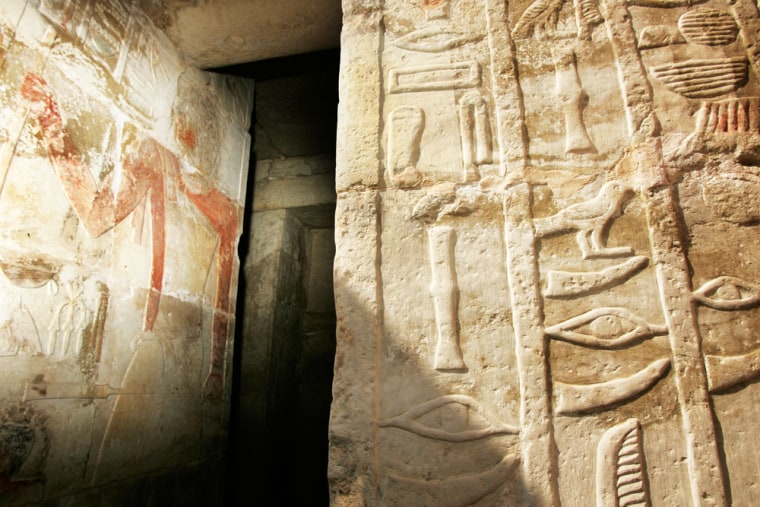 Hieroglyphic details, including eye and tusk symbols representing the dentistry profession, are chiseled on the entrance to tombs honoring three dentists who served the nobility of ancient Egypt. The chief dentist is pictured on the wall at left.