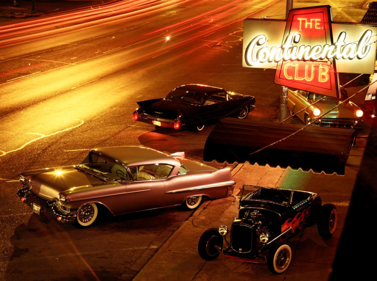 Hot rods and custom cars in front of the Continental Club in Austin, Texas.