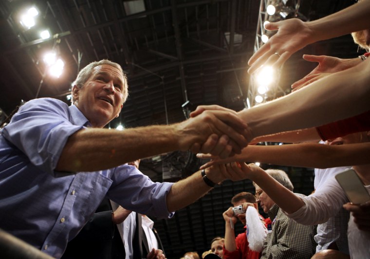 US President George W. Bush shakes hands