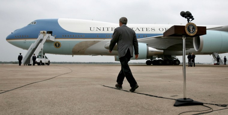 U.S. President Bush walks to Air Force One after making remarks about the Saddam trial verdict at Waco TSTC airport