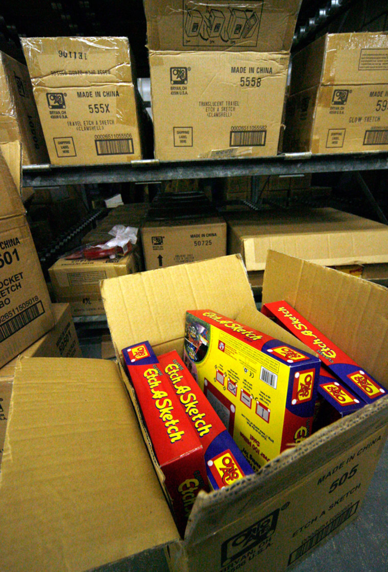 ** ADVANCE FOR WEEKEND, NOV. 11-13 ** A view of an open box of  Etch A Sketch, in a warehouse at The Ohio Art Company in Bryan, Ohio Friday, Nov. 3, 2006.  Ohio Art Co. is banking that replacing Etch A Sketch's familiar red rectangle case with Nickelodeon's most popular cartoon characters will make the iconic baby boomer toy more appealing to kids and young mothers.  (AP Photo/Madalyn Ruggiero)