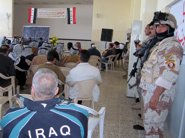 U.S. and Iraqi soldiers and local elders attend a local council meeting at an Iraqi community center in north Baghdad on Saturday. 