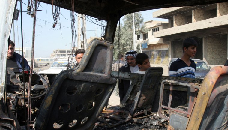 This minibus was destroyed in an explosion in Baghdad on Monday that killed at least 20 people and wounded 18.