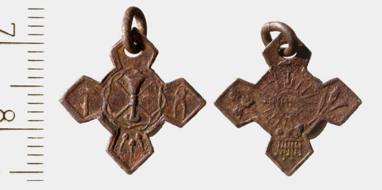 A Christian pendant of the Jesuit order, dated by archaeologists to the 19th century, is stamped with a Holy Grail design. Pendants and other items were found in rubble removed from one of the world's most fascinating and explosive holy places: the Temple Mount, or Haram el-Sharif.