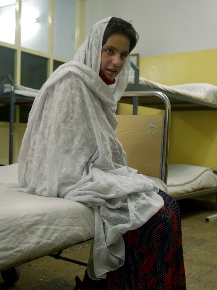 Gusulum, a 16-year-old Afghan girl, is seen at her bed during an interview with the Associated Press at ICRC hospital in Kabul, Afghanistan, on Wednesday.