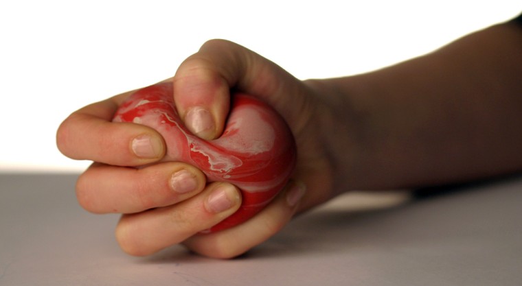 Americans spend $11 billion a year on services and products, like this stress ball, to help us relax.